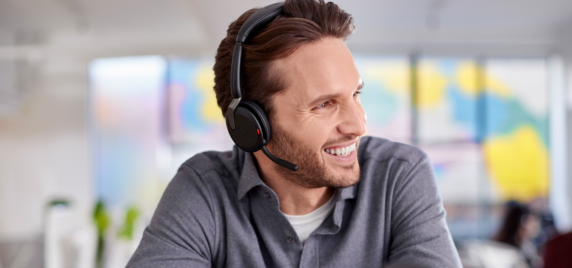 Jabra-Evolve2-65-Flex-Male-Working-in-Office