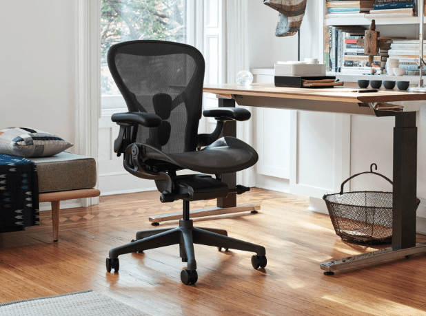 An image of the Herman Miller Aeron sitting by a desk
