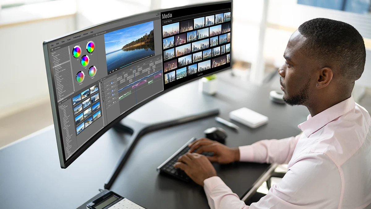 Man using an ultrawide monitor to complete designs on his PC. Source: https://blog.acer.com/en/discussion/1278/ultrawide-vs-dual-monitors-which-one-should-you-choose