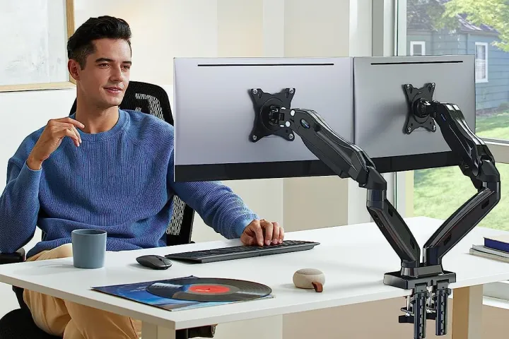 Example dual monitor setup with stand. Source: https://www.digitaltrends.com/computing/third-party-monitor-stands-are-great/